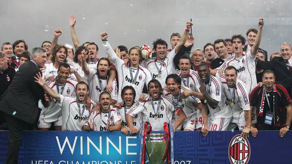 AC Milan's team poses with the trophy  a...