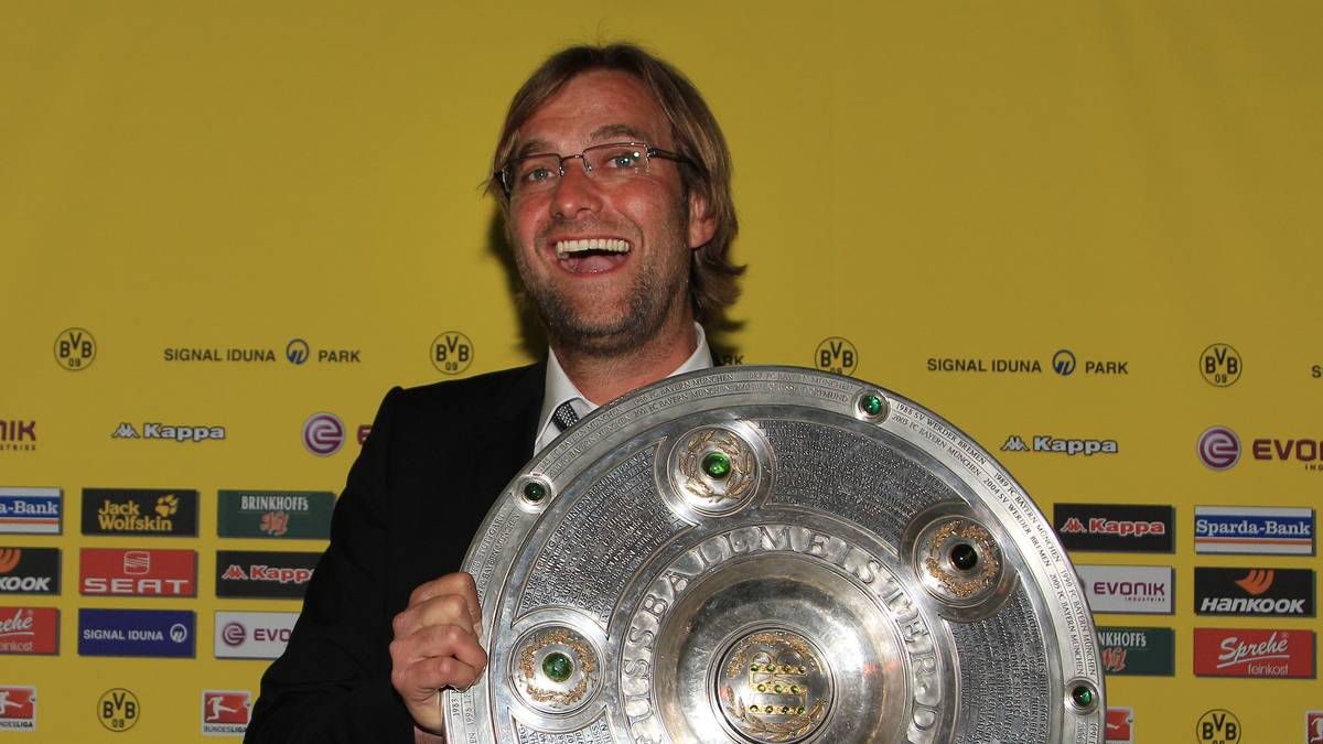 DORTMUND, GERMANY - MAY 14: Head coach Juergen Klopp poses with the German Championship trophy during the dinner to celebrate their German Bundesliga 2010/2011 victory on May 14, 2011 in Dortmund, Germany. (Photo by Pool/Bongarts/Getty Images)