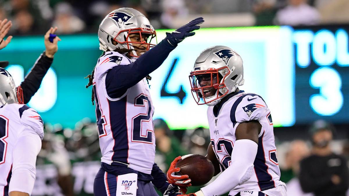 Devin McCourty of the New England Patriots is congratulated by his teammate Stephon Gilmore
