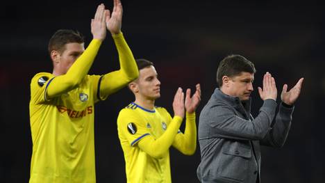 LONDON, ENGLAND - FEBRUARY 21: Aleksei Baga, Manager of FC BATE (R) applauds fans following defeat in the UEFA Europa League Round of 32 Second Leg match between Arsenal and BATE Borisov at Emirates Stadium on February 21, 2019 in London, United Kingdom. (Photo by Mike Hewitt/Getty Images)