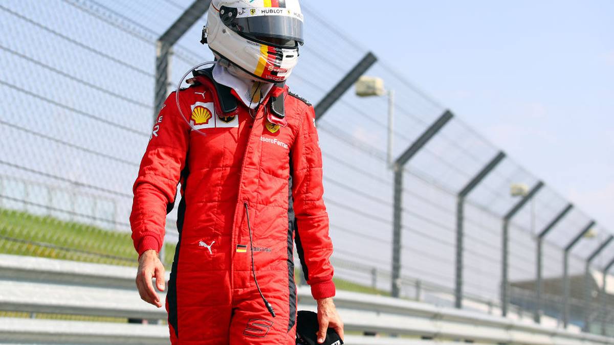 NORTHAMPTON, ENGLAND - AUGUST 09: Sebastian Vettel of Germany and Ferrari looks on in parc ferme during the F1 70th Anniversary Grand Prix at Silverstone on August 09, 2020 in Northampton, England. (Photo by Bryn Lennon/Getty Images)