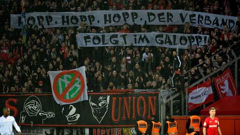 Union Berlin fans display banners criticising the German FA (DFB) during the German Cup (DFB Pokal) quarter-final football match Bayer Leverkusen v Union Berlin in Leverkusen, western Germanyon March 4, 2020. (Photo by SASCHA SCHUERMANN / AFP) / DFB REGULATIONS PROHIBIT ANY USE OF PHOTOGRAPHS AS IMAGE SEQUENCES AND QUASI-VIDEO. (Photo by SASCHA SCHUERMANN/AFP via Getty Images)