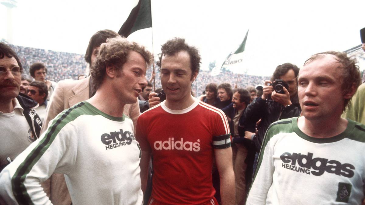 HERBERT WIMMER: Wurde von allen nur "Hacki" gerufen. Kam 1966 zur Borussia und blieb dort bis zum Ende seiner Profikarriere 1978. Ein Arbeiter, Dauerläufer auf der Achterposition, dazu ungemein torgefährlich, markierte 51 Tore und legte weitere 41 in seinen 366 Bundesligaspielen auf. Welt- und Europameister, UEFA-Cup-Sieger 1975 bei allen fünf Meistertiteln der Borussia dabei