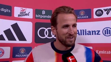 Topstürmer Harry Kane hat die 20-Tore-Marke mit seinem Traumtor beim 8:1-Sieg gegen den VfL Wolfsburg erreicht und spricht darüber, wie er sich beim Rekordmeister fühlt.