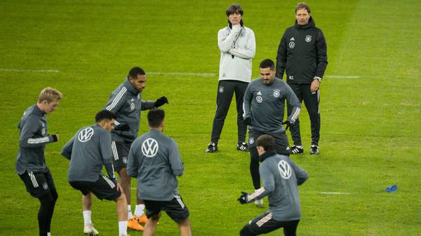 DUESSELDORF, GERMANY - NOVEMBER 15: Head coach Joachim Loew and assistant coach Marcus Sorg watch their players warming up during a German National Team training session at Merkur Spiel-Arena on November 15, 2019 in Duesseldorf, Germany. Germany will play a UEFA Euro 2020 qualifier match against Belarus on November 16, 2019 in Moenchengladbach. (Photo by Lars Baron/Bongarts/Getty Images)
