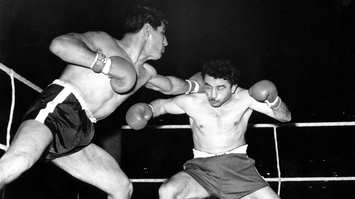 PETER MÜLLER (links): Sein Schlag gegen Ringrichter Max Pippow machte Müller 1952 weltberühmt. Er hatte sich im Duell mit seinem ewigen Rivalen Hans Stretz benachteiligt gefühlt und sich zu jener legendären Tat hinreißen lassen. Müller wurde disqualifiziert und Pippow behielt seinen Titel als Deutscher Meister. Aber Müller war auch erfolgreich: Fünfmal wurde er Deutscher Meister im Mittelgewicht