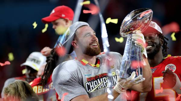 MIAMI, FLORIDA - FEBRUARY 02: Travis Kelce #87 of the Kansas City Chiefs celebrates with the Vince Lombardi Trophy after defeating the San Francisco 49ers 31-20 in Super Bowl LIV at Hard Rock Stadium on February 02, 2020 in Miami, Florida. (Photo by Maddie Meyer/Getty Images)