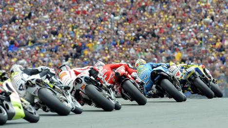 MotoGP riders compete on the racetrack d