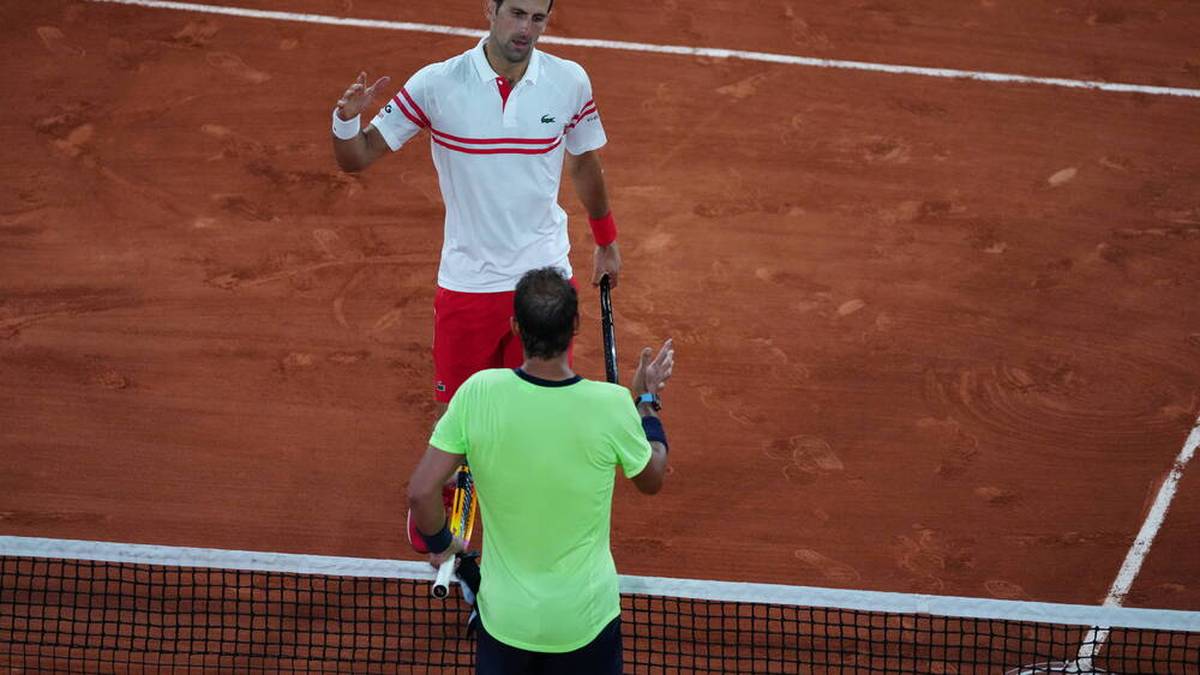 (210612) -- PARIS, June 12, 2021 -- Rafael Nadal (bottom) of Spain and Novak Djokovic of Serbia greet each other after their men s singles semifinal at the French Open tennis tournament at Roland Garros in Paris, France, June 11, 2021. ) (SP)FRANCE-PARIS-TENNIS-ROLAND GARROS-FRENCH OPEN-MEN S SINGLES-SEMIFINALS GaoxJing PUBLICATIONxNOTxINxCHN
