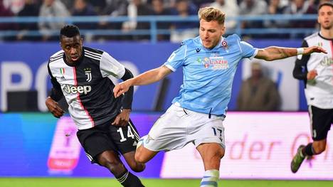 Lazio's Italian forward Ciro Immobile attempts a shot as he is marked by Juventus' French midfielder Blaise Matuidi (L) during the Supercoppa Italiana final football match between Juventus and Lazio at the King Saud University Stadium in the Saudi capital Riyadh on December 22, 2019. (Photo by GIUSEPPE CACACE / AFP) (Photo by GIUSEPPE CACACE/AFP via Getty Images)
