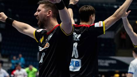Deutsche Handballer freuen sich über Sieg