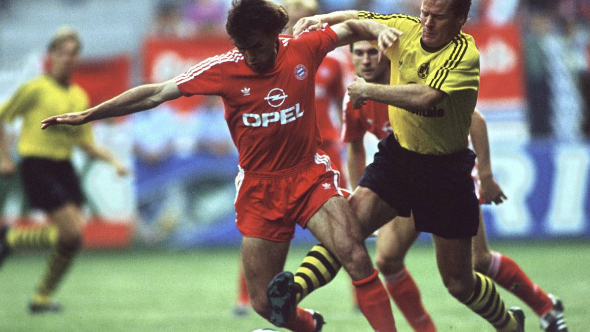 MURDO MACLEOD: Der Vorreiter der kampfstarken Schotten bei Borussia Dortmund. MacLeod spielt ab 1987 in der Bundesliga für den BVB. Dort entwickelt er sich schnell zum Publikumsliebling und gewinnt mit Dortmund den DFB-Pokal 1989. Nach drei erfolgreichen Jahren kehrt er nach Schottland zurück