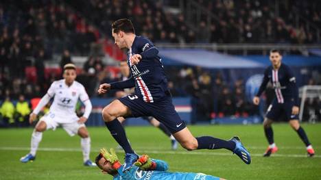 Paris Saint-Germain's German midfielder Julian Draxler jumps over Lyon's Portuguese goalkeeper Anthony Lopes during the French L1 football match between Paris Saint-Germain (PSG) and Lyon (OL) at the Parc des Princes stadium in Paris, on February 9, 2020. (Photo by FRANCK FIFE / AFP) (Photo by FRANCK FIFE/AFP via Getty Images)