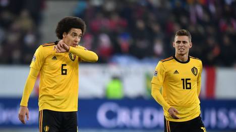 Belgium's midfielder Axel Witsel (L) and teammate forward Thorgan Hazard reacts during the UEFA Nations League, league A, group 2 football match between Switzerland and Belgium at the Swissporarena stadium in Lucerne, on November 18, 2018. (Photo by Fabrice COFFRINI / AFP)        (Photo credit should read FABRICE COFFRINI/AFP/Getty Images)