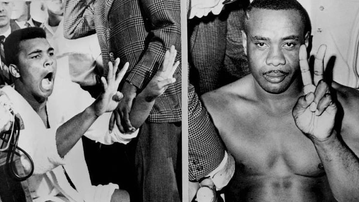 Sonny Liston (r.) und Cassius Clay alias Muhammad Ali beim Wiegen