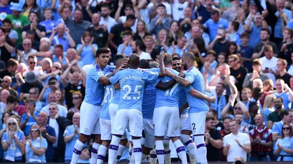 Manchester City's Algerian midfielder Riyad Mahrez celebrates with teammates after he scores his team's third goal during the English Premier League football match between Manchester City and Watford at the Etihad Stadium in Manchester, north west England, on September 21, 2019. (Photo by Oli SCARFF / AFP) / RESTRICTED TO EDITORIAL USE. No use with unauthorized audio, video, data, fixture lists, club/league logos or 'live' services. Online in-match use limited to 120 images. An additional 40 images may be used in extra time. No video emulation. Social media in-match use limited to 120 images. An additional 40 images may be used in extra time. No use in betting publications, games or single club/league/player publications. /         (Photo credit should read OLI SCARFF/AFP/Getty Images)