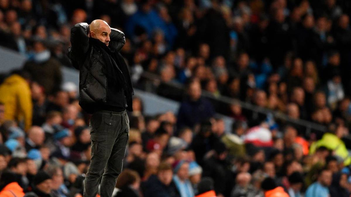 Manchester City's Spanish manager Pep Guardiola reacts during the English Premier League football match between Manchester City and Manchester United at the Etihad Stadium in Manchester, north west England, on December 7, 2019. (Photo by Oli SCARFF / AFP) / RESTRICTED TO EDITORIAL USE. No use with unauthorized audio, video, data, fixture lists, club/league logos or 'live' services. Online in-match use limited to 120 images. An additional 40 images may be used in extra time. No video emulation. Social media in-match use limited to 120 images. An additional 40 images may be used in extra time. No use in betting publications, games or single club/league/player publications. /  (Photo by OLI SCARFF/AFP via Getty Images)