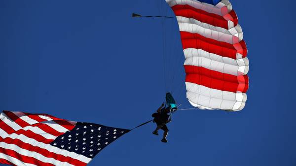 AUSTIN, TEXAS - NOVEMBER 03: A parachute display is seen over the grid before the F1 Grand Prix of USA at Circuit of The Americas on November 03, 2019 in Austin, Texas. (Photo by Clive Mason/Getty Images)