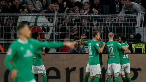 Bremen's Austrian forward Marco Friedl (2ndR) celebrates with team mates scoring the 2-2 goal during the German first division Bundesliga football match BVB Borussia Dortmund v SV Werder Bremen in Dortmund, western Germany, on September 28, 2019. (Photo by SASCHA SCHUERMANN / AFP) / DFL REGULATIONS PROHIBIT ANY USE OF PHOTOGRAPHS AS IMAGE SEQUENCES AND/OR QUASI-VIDEO        (Photo credit should read SASCHA SCHUERMANN/AFP/Getty Images)