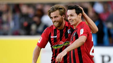 FREIBURG IM BREISGAU, GERMANY - OCTOBER 26: Nicolas Hofler of Sport-Club Freiburg celebrates with teammate Lucas Holer after scoring his team's first goal during the Bundesliga match between Sport-Club Freiburg and RB Leipzig at Schwarzwald-Stadion on October 26, 2019 in Freiburg im Breisgau, Germany. (Photo by Daniel Kopatsch/Bongarts/Getty Images)