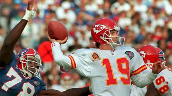 FILES, UNITED STATES:  This 30 October 94 file photo shows Kansas City Chiefs quarterback Joe Montana (19) preparing to pass against the rush of Buffalo Bills Bruce Smith (78) in Buffalo, NY. Montana is widely expected to announce his retirement from professional football 18 April in San Francisco. Montana led the San Francisco 49ers to four Super Bowl victories in the 1980s.   AFP  PHOTO (Photo credit should read JEFF HAYNES/AFP via Getty Images)