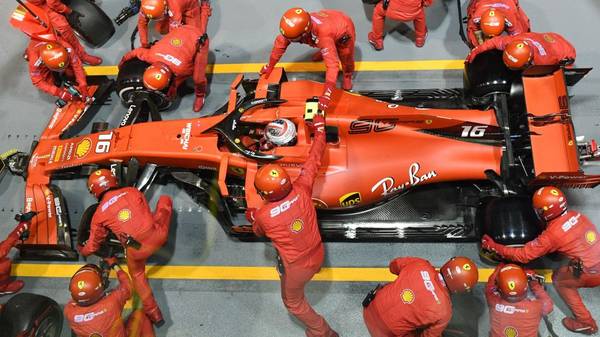 Ferrari's Monegasque driver Charles Leclerc has a pit stop during the Formula One Singapore Grand Prix night race at the Marina Bay Street Circuit in Singapore on September 22, 2019. (Photo by Mladen ANTONOV / AFP)        (Photo credit should read MLADEN ANTONOV/AFP/Getty Images)