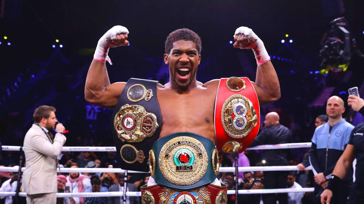 DIRIYAH, SAUDI ARABIA - DECEMBER 07: Anthony Joshua poses for a photo with the IBF, WBA, WBO & IBO World Heavyweight Title belts after the IBF, WBA, WBO & IBO World Heavyweight Title Fight between Andy Ruiz Jr and Anthony Joshua during the Matchroom Boxing 'Clash on the Dunes' show at the Diriyah Season on December 07, 2019 in Diriyah, Saudi Arabia (Photo by Richard Heathcote/Getty Images)
