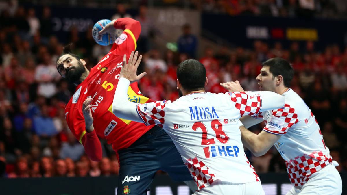 STOCKHOLM, SWEDEN - JANUARY 26: Jorge Maqueda Pena of Spain is challenged by Zeljko Musa ans Marko Mamic (L-R) of Croatia  during the Men's EHF EURO 2020 final match between Spain and Croatia at Tele2 Arena on January 26, 2020 in Stockholm, Sweden. (Photo by Martin Rose/Bongarts/Getty Images )