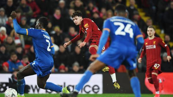 LIVERPOOL, ENGLAND - FEBRUARY 04: Neco Williams of Liverpool shoots as Aaron Pierre of Shrewsbury Town attempts to bock during the FA Cup Fourth Round Replay match between Liverpool FC and Shrewsbury Town at Anfield on February 04, 2020 in Liverpool, England. (Photo by Gareth Copley/Getty Images)