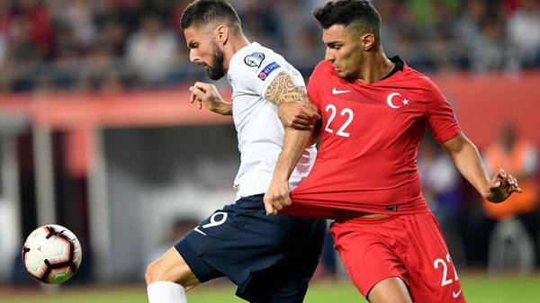 France's Forward Olivier Giroud (L) vies with Turkey's defender Kaan Ayhan during the Euro 2020 football qualification match between Turkey and France at the Buyuksehir Belediyesi stadium in Konya, on June 8, 2019. (Photo by Bulent Kilic / AFP)        (Photo credit should read BULENT KILIC/AFP/Getty Images)
