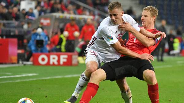 Latvia's Forward Vladislavs Gutkovskis and Austria's Defender Martin Hinteregger vie for the ball during the UEFA Euro 2020 qualification football match between Austria and Latvia in Salzburg, Austria, on September 6, 2019. (Photo by BARBARA GINDL / APA / AFP) / Austria OUT        (Photo credit should read BARBARA GINDL/AFP/Getty Images)