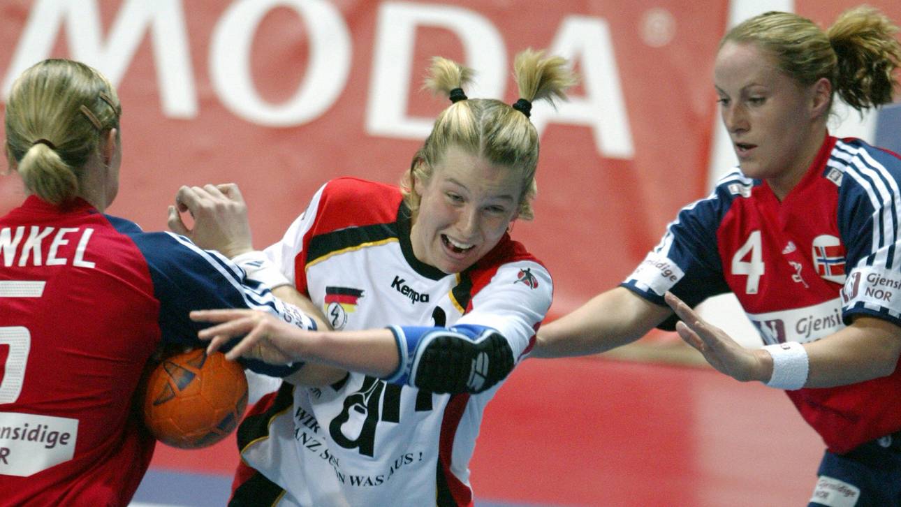 German player Nadine Krause (C) scores a