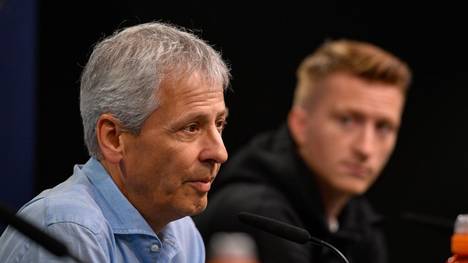 Dortmund's Swiss coach Lucien Favre and Dortmund's German forward Marco Reus are pictured during a press conference in Dortmund, western Germany, on September 16, 2019 on the eve of the UEFA Champions League Group F football match between Borussia Dortmund and Barcelona. (Photo by SASCHA SCHUERMANN / AFP)        (Photo credit should read SASCHA SCHUERMANN/AFP via Getty Images)