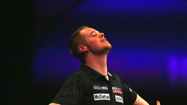 LONDON, ENGLAND - DECEMBER 23: Max Hopp of Germany celebrates winning his first round match against Mervyn King of England during the William Hill PDC World Darts Championships on Day Six at Alexandra Palace on December 23, 2014 in London, England. (Photo by Charlie Crowhurst/Getty Images)