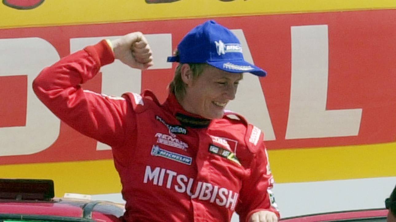 Germany's Jutta Kleinschmidt (R) celebrates on the