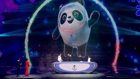 The mascot for the Beijing 2022 Winter Olympic, 'Bing Dwen Dwen', is projected to a screen on the stage during the official reveal of the mascots at Shougang Ice Hockey Arena, Shougang Park, Shijingshan District, Beijing in September 17, 2019. (Photo by NOEL CELIS / AFP)        (Photo credit should read NOEL CELIS/AFP/Getty Images)