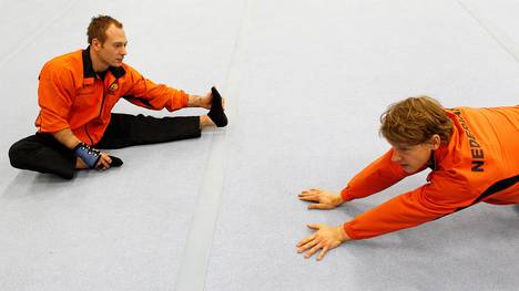 Dutch gymnasts Epke Zonderland (R) and Y