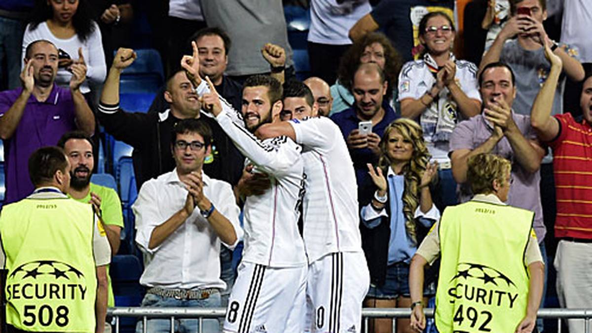 In Madrid geht es von Beginn an zur Sache: Nacho (l.) und James Rodriguez bejubeln das frühe 1:0 gegen den FC Basel
                  
                  
                  