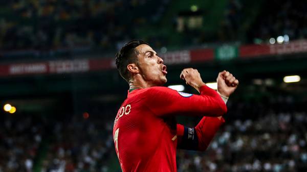 Portugal's forward Cristiano Ronaldo celebrates after scoring a goal during the Euro 2020 qualifier group B football match between Portugal and Luxembourg at the Jose Alvalade stadium in Lisbon on October 11, 2019. (Photo by CARLOS COSTA / AFP) (Photo by CARLOS COSTA/AFP via Getty Images)