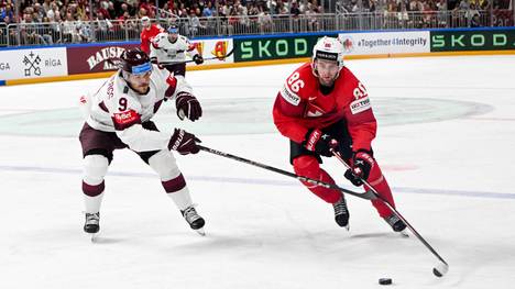 RIGA, LATVIA - MAY 23: Janis Moser of Switzerland enters the offensive zone against Renars Krastenbergs of Latvia during the 2023 IIHF Ice hockey, Eishockey World Championship, WM, Weltmeisterschaft Finland - Latvia game between Switzerland and Latvia at Arena Riga on May 23, 2023 in Riga, Latvia. Riga Arena Riga Latvia *** RIGA, LATVIA MAY 23 Janis Moser of Switzerland enters the offensive zone against Renars Krastenbergs of Latvia during the 2023 IIHF Ice Hockey World Championship Finland Latvia game between Switzerland and Latvia at Arena Riga on May 23, 2023 in Riga, Latvia Riga Arena Riga Latvia PUBLICATIONxNOTxINxSUI Copyright: xJustPictures.ch AndreaxBrancax