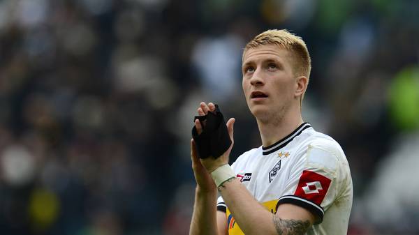 Moenchengladbach's midfielder Marco Reus applauds after the German first division Bundesliga football match Borussia Moenchengladbach vs 1. FC Cologne in the German city of Moenchengladbach on April 15, 2012. Moenchengladbach won the match 3-0. AFP PHOTO / PATRIK STOLLARZ+++ RESTRICTIONS / EMBARGO - DFL LIMITS THE USE OF IMAGES ON THE INTERNET TO 15 PICTURES (NO VIDEO-LIKE SEQUENCES) DURING THE MATCH AND PROHIBITS MOBILE (MMS) USE DURING AND FOR FURTHER TWO HOURS AFTER THE MATCH. FOR MORE INFORMATION CONTACT DFL.        (Photo credit should read PATRIK STOLLARZ/AFP/GettyImages)