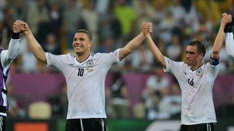 German forward Lukas Podolski (L) and Ge