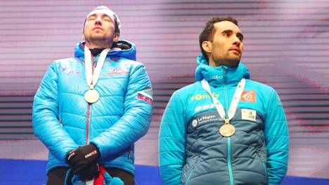 Alexander Loginov (l.) steht bei der Biathlon-WM in der Kritik