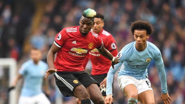 MANCHESTER, ENGLAND - APRIL 07:  Paul Pogba of Manchester United is challenged by Leroy Sane of Manchester City during the Premier League match between Manchester City and Manchester United at Etihad Stadium on April 7, 2018 in Manchester, England.  (Photo by Michael Regan/Getty Images)