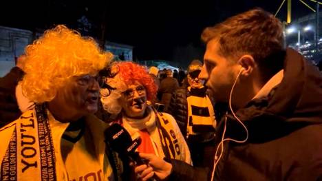 Vor dem Spiel zwischen Borussia Dortmund und dem SC Freiburg zeigt ein Ehepaar dass es zwischen den verschiedenen Fanlager auch durchaus krachen kann. 