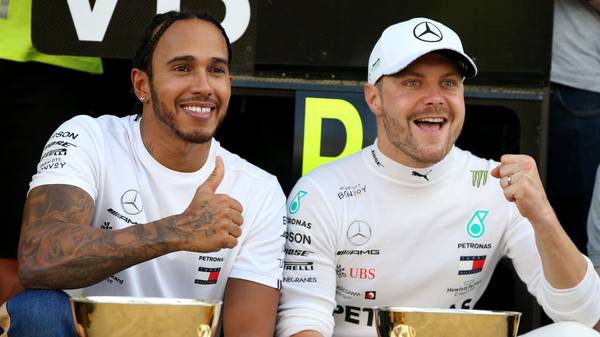 SOCHI, RUSSIA - SEPTEMBER 29: Race winner Lewis Hamilton of Great Britain and Mercedes GP and second placed Valtteri Bottas of Finland and Mercedes GP celebrate with their team after the F1 Grand Prix of Russia at Sochi Autodrom on September 29, 2019 in Sochi, Russia. (Photo by Charles Coates/Getty Images)