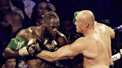 Deontay Wilder (l.) will sich gegen Tyson Fury den Schwergewichtstitel sichern