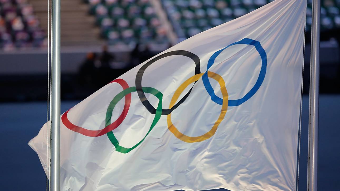 Olympische Flagge auf Halbmast