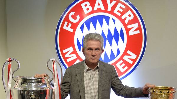 Bayern Munich's head coach Jupp Heynckes poses with four trophy's after giving his farewell press conference in Munich, southern Germany, on June 4, 2013. Heynckes spoke about his future after he won with his team the UEFA Champions League, the German Football Cup (DFB-Pokal), the Super Cup and the Bundesliga German League during the season 2012/2013.     AFP PHOTO / CHRISTOF STACHE        (Photo credit should read CHRISTOF STACHE/AFP via Getty Images)