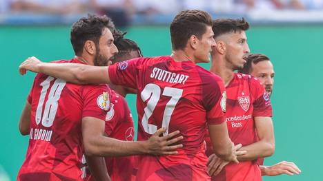 ROSTOCK, GERMANY - AUGUST 12: Hamadi Al Ghaddioui of VfB Stuttgart celebrates with team mates after scoring his team's first goal during the DFB Cup first round match between Hansa Rostock and VfB Stuttgart at Ostseestadion on August 12, 2019 in Rostock, Germany. (Photo by Boris Streubel/Bongarts/Getty Images)